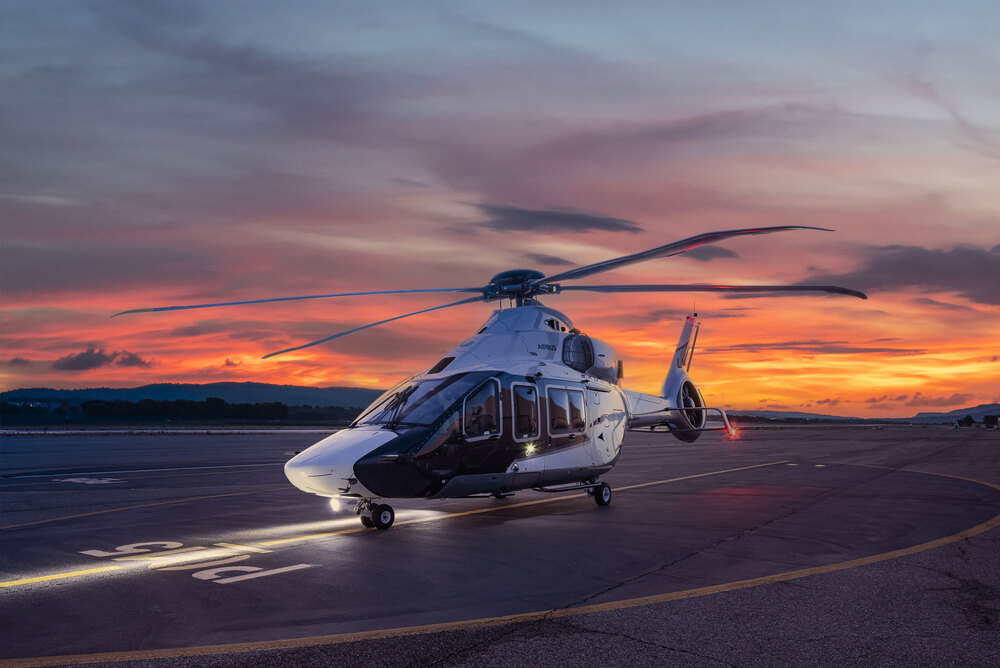 Pilot performing pre-flight checks on a helicopter in London